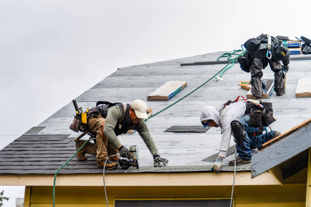 Professional Gutter Installation technician working in Gower, MO